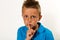 Boy making keep quiet gesture