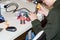 A boy making a robot with the electric soldering iron