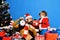 Boy and man with beard and excited faces celebrate Christmas.