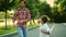 Boy and man legs dancing barefoot on street. Father and boy having fun outdoors