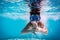 Boy in mask dive in swimming pool