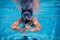 Boy in mask dive in swimming pool