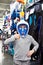 Boy in mask for scuba diving in sport shop