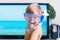 Boy mask and snorkel dive imitating swimming TV