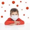 A boy in a medical mask. Around the viruses