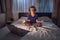 Boy meditates on bed using meditation app. sport, technology and healthy lifestyle concept