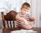 A boy is mixing mincemeat in a bowl