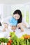 Boy and mother mixing salad for lunch