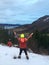 Boy on Mountain hikking with his dog