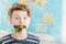 Boy with Mouthful of Lettuce Greens in Classroom