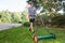 Boy mowing grass with push reel mower