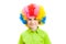 The boy in a multi-coloured clown wig