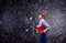 Boy with notebooks against big blackboard with mathematical symbols