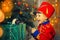 A boy in a nutcracker costume plays with the mouse symbol of the year.