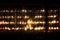 Boy offering a candle at the temple Jaya Sri Maha Bodhiya in the night behind a glass wall, Anuradhapura, Sri Lanka