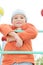 Boy in orange on climbing staircase