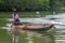 A boy paddles his outrigger canoe on the Madu River in Sri Lanka.