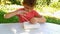 boy passionate about archaeological excavations, sitting at table in nature. excavation kit.