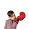 Boy with patch on his forehead unzips boxing glove