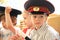 Boy in peaked cap in costume of policeman