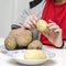 Boy peeling potatoes