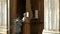 Boy performing catholic confession at the basilica santa maria maggiore, rome