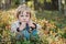 Boy picking bilberries in a forest