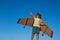 Boy pilot against a blue sky. Cute dreamer boy playing with a cardboard airplane. Childhood. Fantasy, imagination.