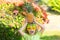 Boy with pineapple on head, plays with fresh tropical fruit outdoorst. Excited funny kid. Child face with amazed