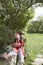 Boy In Pirate Costume With Arms Crossed In Garden