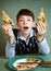 Boy with pizza plate on blue background