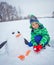 Boy plaing in the snow