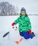 Boy plaing in the snow