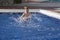 Boy plaiyng in swimming pool