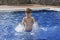 Boy plaiyng in swimming pool