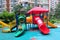 A boy play on the colorful slide