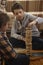 Boy play Jenga game together. children playing at home interior