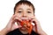 boy playfully eating crayfish