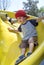 Boy on a playground slide