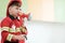 Boy playing as fireman police occupation in kindergarten class,