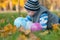 Boy playing on the autumn grass