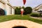 Boy playing bean bag toss in the backyard!