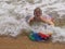 Boy playing with a bodyboard