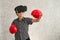 A boy is playing boxing game with 3D virtual reality headset.