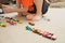 Boy playing with car collection on carpet.Child hand play. Transportation, airplane, plane and helicopter toys for children