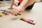 Boy playing with car collection on carpet.Child hand play. Transportation, airplane, plane and helicopter toys for children