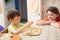 Boy playing with dough with mummy