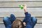 Boy playing with fidget spinner outdoors. Top view