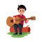 Boy playing guitar sitting on a log, camping, hiking concept