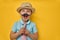 Boy playing and holding paper mustache